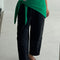 model wearing kelly green shawl around their waist