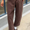 model wearing brown gardners pants with front patches
