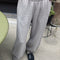 model wearing heather grey jogger sweatpants