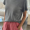 model wearing heather grey tee