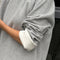up close of model wearing heather grey relaxed fit raglan sweatshirt
