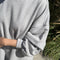 up close of model wearing heather grey french terry swing dress