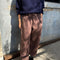 model wearing brown gardners pants with front patches
