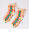 colorful checkerboard chenille grip socks with bow detail