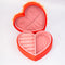 interior of red heart shaped jewelry box with pink interior and cream scalloped detail with 'sweet little jewelry' across the front