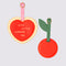 Set of 2 vegan leather luggage tags, cherry and heart shapes with buckle straps.