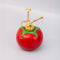 reverse side of ceramic tomato plant mister with gold pump