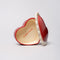 interior of ceramic heart shaped trinket box with white scalloped trim and cursive 'everything' in the inside