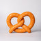 soft pretzel shaped de-stress ball with white heart shaped 'salt' on top