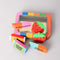 set of 6 colorful erasers in a tin container with a window in the front