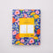 back view of blue to-do planner with colorful pink, orange, yellow and blue floral print with 'DAILY PLANNER' across the front
