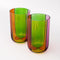 side view of set of two high ball glass set with four colors sections: pink, green, orange and red