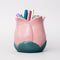 light pink tulip shaped pencil holder with pens inside