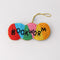 colorful beaded ornament with beaded 'bookworm' across the front with old thread for hanging