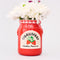 strawberry jam petite ceramic vase with a bouquet in the top