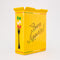side view of yellow pasta box ceramic vase that says 'BUON APPETITO' with flowers inside