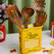 yellow pasta box ceramic vase with wooden utensils inside