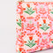 side view of pink folk floral quilted pouch