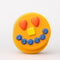 Front view of smiling pancake de stress ball with cute face design