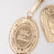 up close of 'WHAT A DREAM gold metallic locket luggage tag