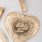Up close of 'FILLED WITH LOVE' gold metallic locket luggage tags