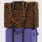 brown leopard cloud carry-on on a suitcase