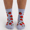 model wearing light blue crew socks with all over strawberry print