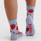back view of light blue crew socks with all over strawberry print