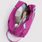 fuchsia dopp kit with dolphin print filled with items