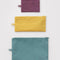 set of 3 jewel colored flat pouch set: wild plum, yellow, and teal