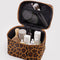 black interior of large cosmetic case with brown leopard print