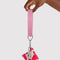 model holding pink logo keychain with smiley face print