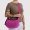 model carrying deep fuchsia medium crescent bag