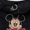 interior key leash of black medium crescent bag with white piping and embroidered mickey head and red 'MICKEY'