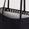 up close of reversible black tote with black and white gingham interior
