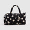 black duffle bag with cream polka dots