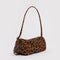 side view of brown leopard nylon loaf bag