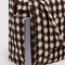 blurred gingham brown small cloud carry on bag with a laptop popping out