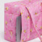 bright pink small cloud carry on bag with gold melting star print with a laptop coming from the back sleeve