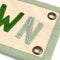 up close of beige canvas banner with colorful 'SLOW DOWN' and sage green trim