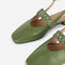 up close of front of cactus slingback flat with large grommet buckle and square toe