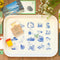 cream large tray with blue moomin characters surrounded by dried flowers and knick knacks