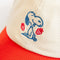 up close of cream dad hat with red bill and embroidered snoopy and strawberry print