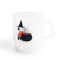 white milk glass mug with snoopy dressed as a witch stirring a brew