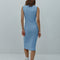 back view of model wearing light blue form fitting knit midi dress with button henley front and embroidered clementine details