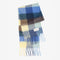 folded thick scarf with various shades of blue checkers and fringe
