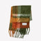 folded thick scarf with orange, burnt red, and moss green print and fringe