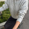 side view of model wearing grey mohair button up cardigan