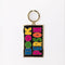 enamel keychain with black rectangle with colorful 'book person' across the front