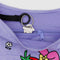 black key leash in lavender medium nylon crescent bag with embroidered my melody hugging a strawberry and white flower print